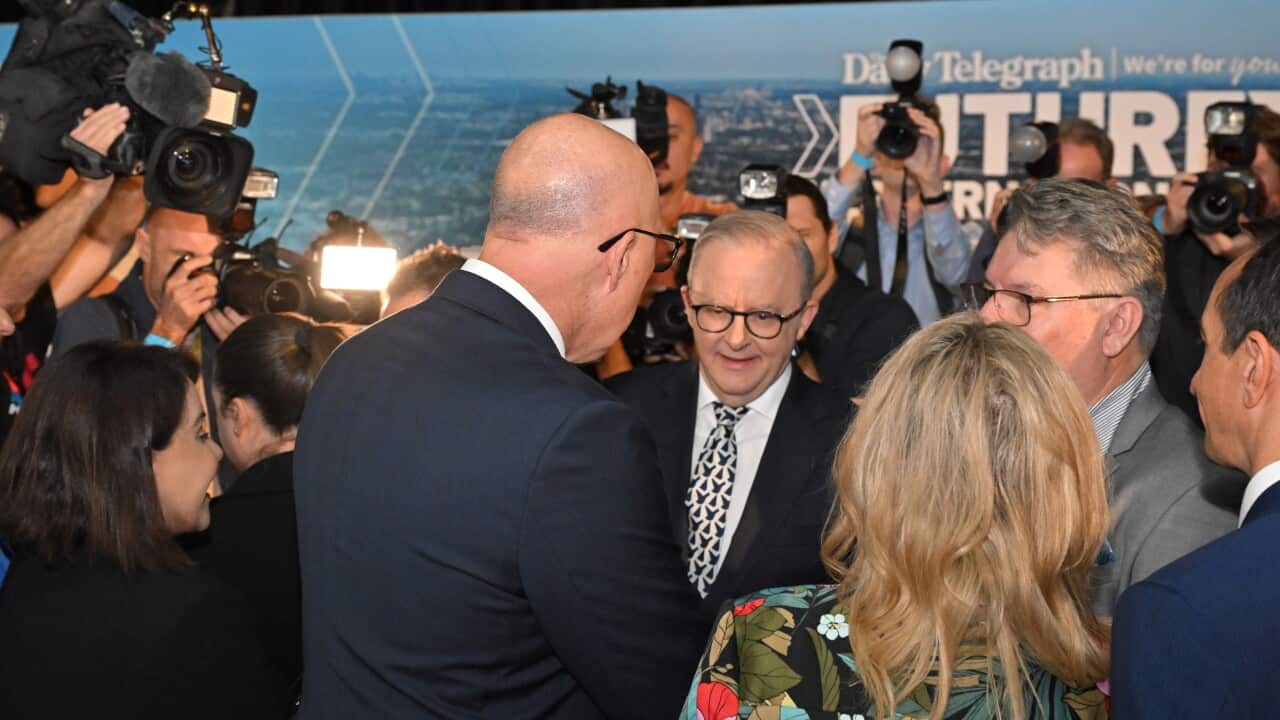 Anthony Albanese and Peter Dutton meet while cameras watch on