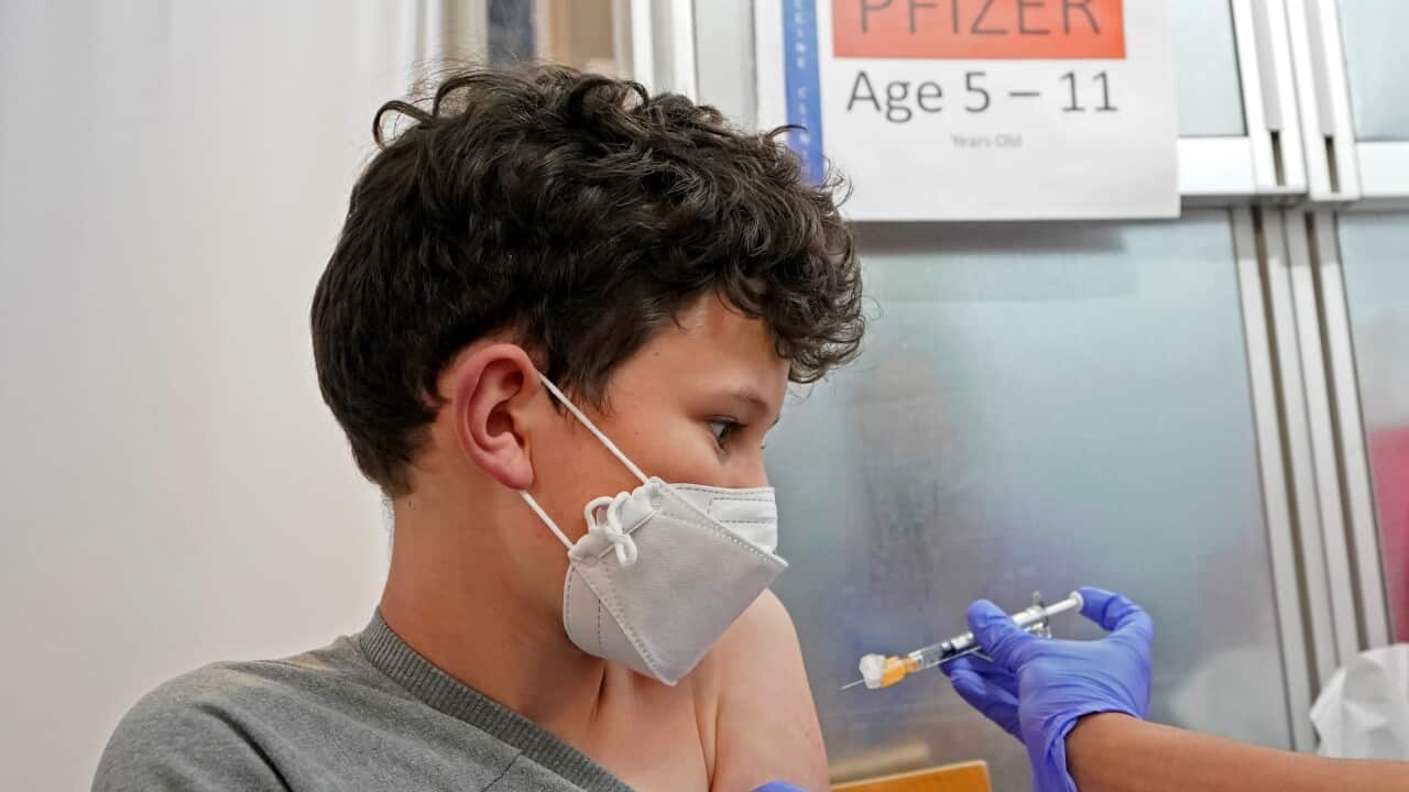 A kid in the U.S. gets the first shot of the Pfizer COVID-19.