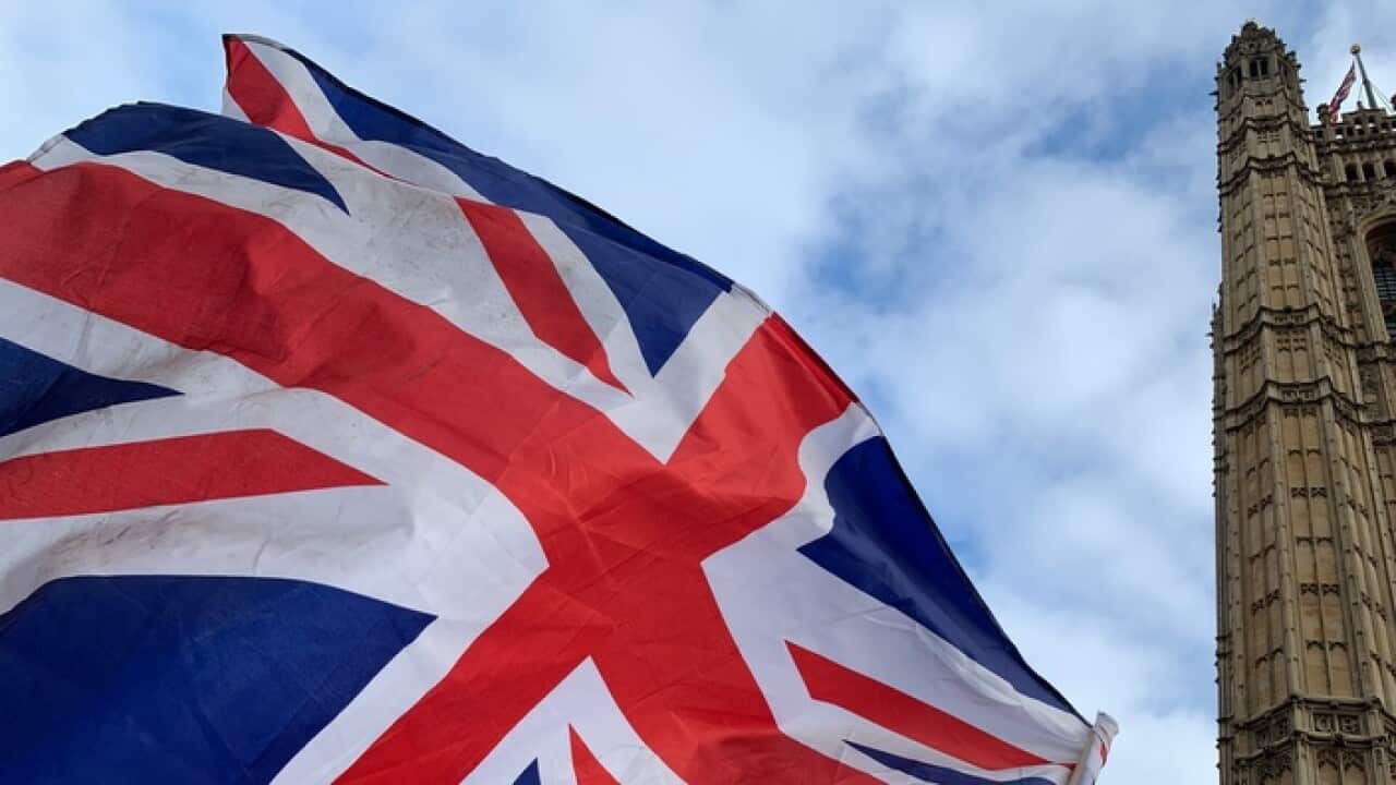 Protesters demonstrate outside the Houses of Parliament in London