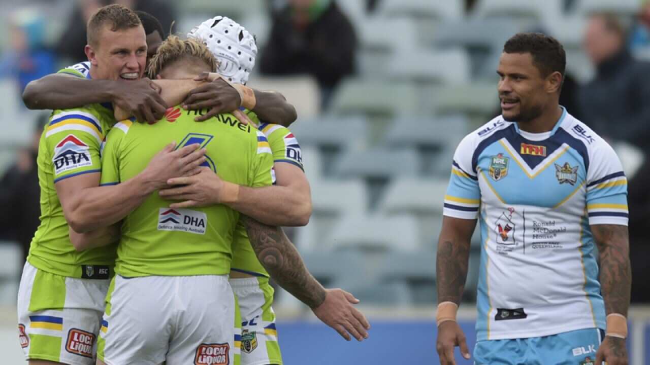 Blake Austin of Canberra celebrates with Jarrod Croker.