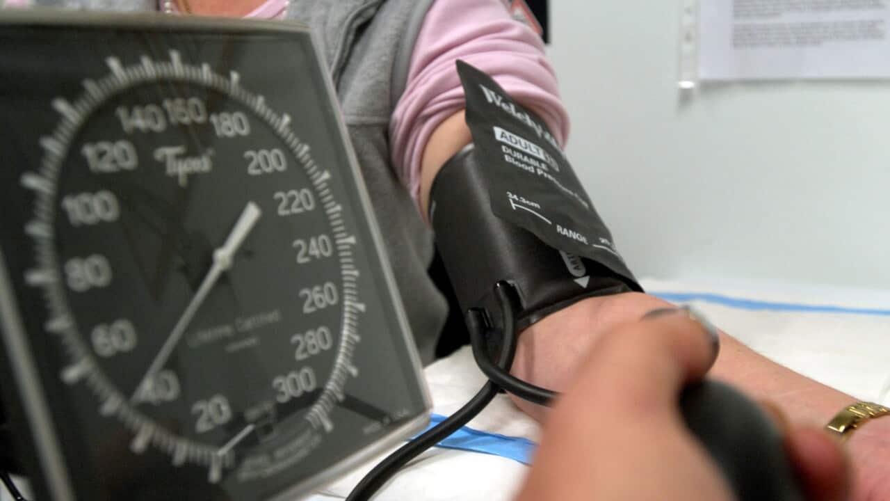 A patient having their blood pressure taken
