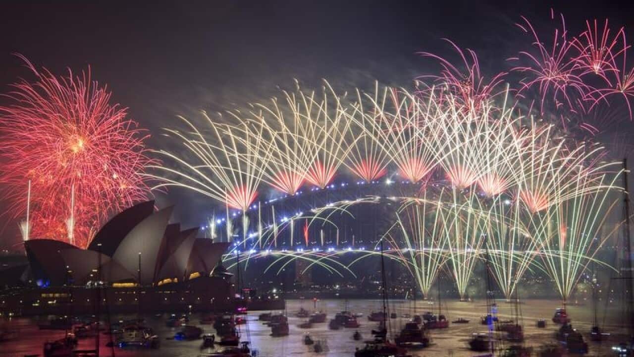 Fireworks explode over the Sydney Harbour
