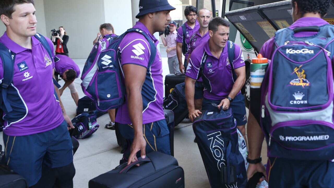 Melbourne Storm players board a bus to the airport