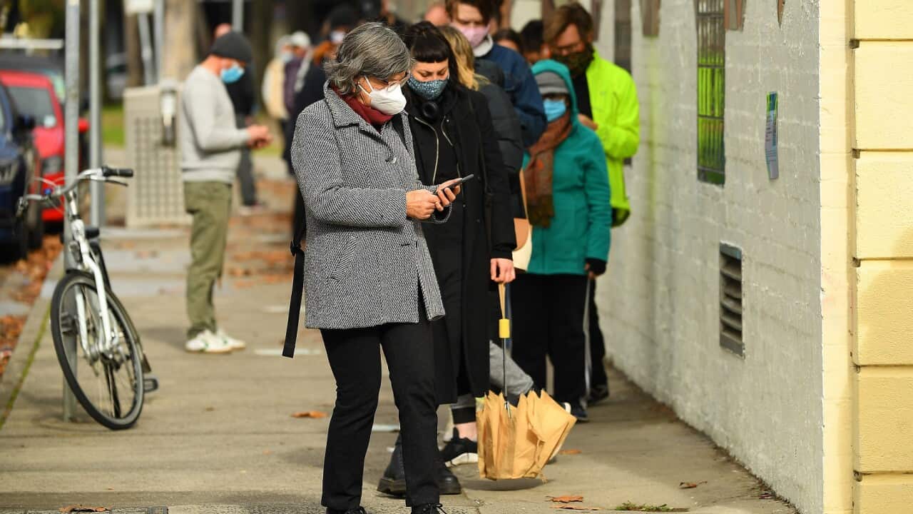 People are seen waiting in a line to receive covid19 tests at a walk-in covid19 testing facility in Melbourne