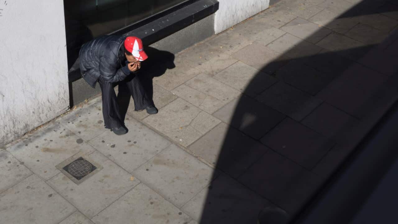 Depressed teen on a city street