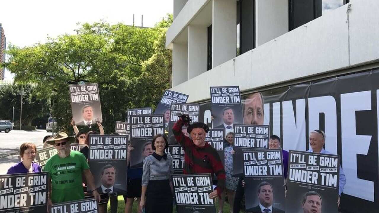 Queensland Council of Unions members protest in Brisbane