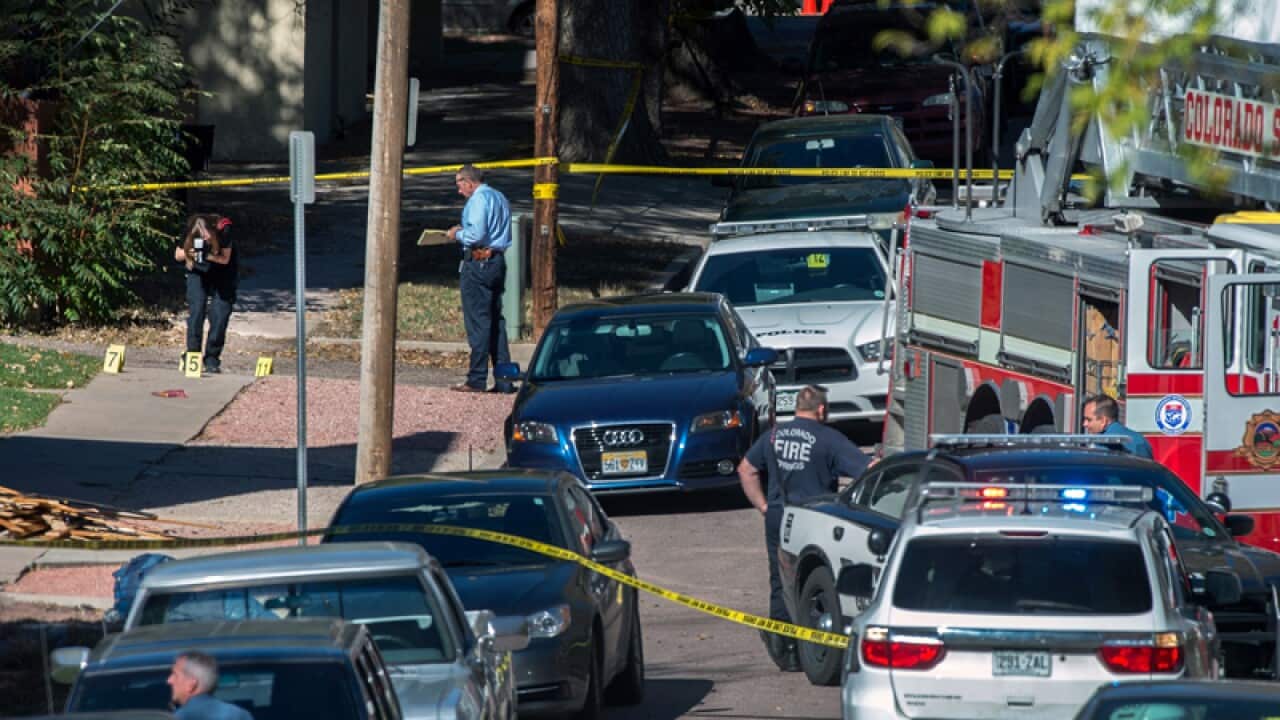 Police investigate the scene after a shooting