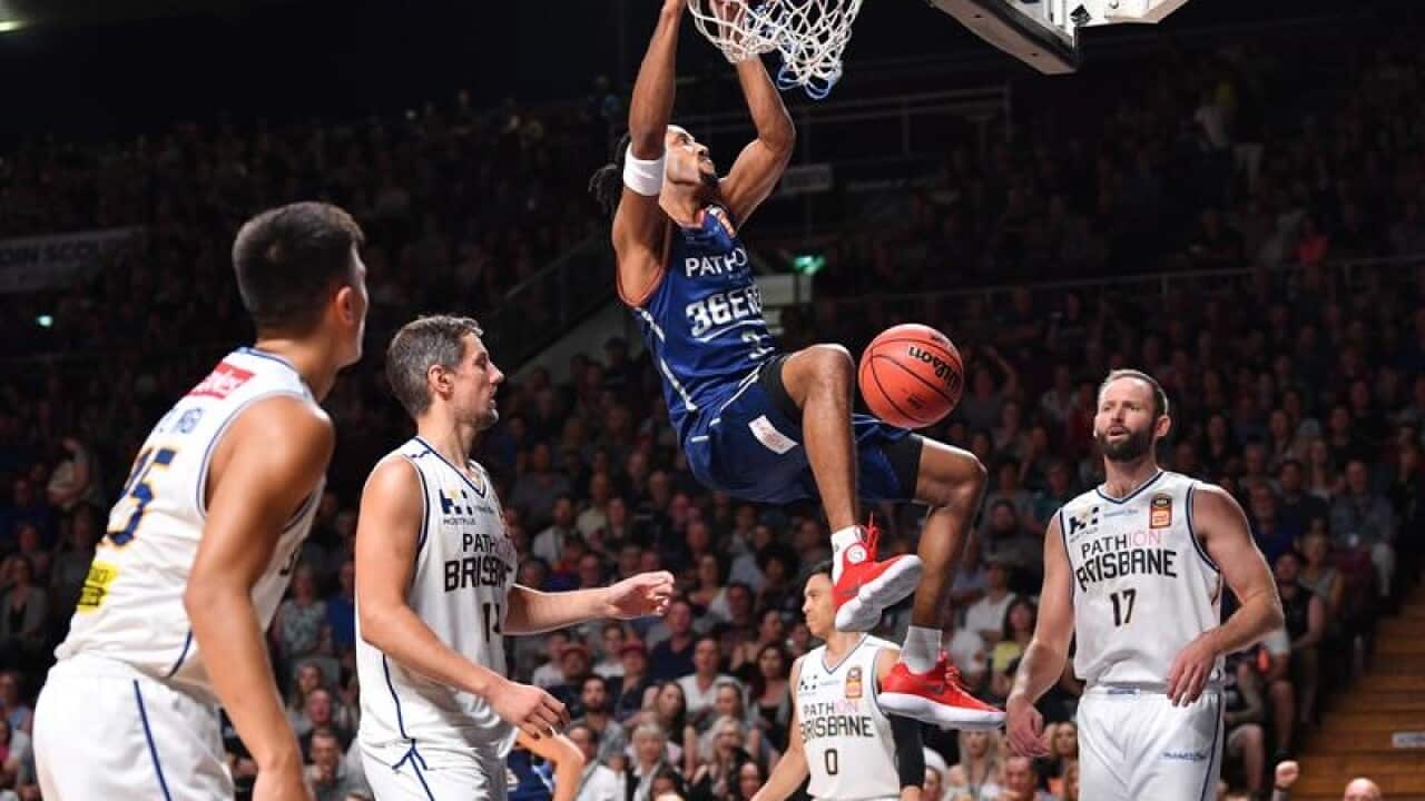 Josh Childress of the Adelaide 36ers dunks the basket during a game.
