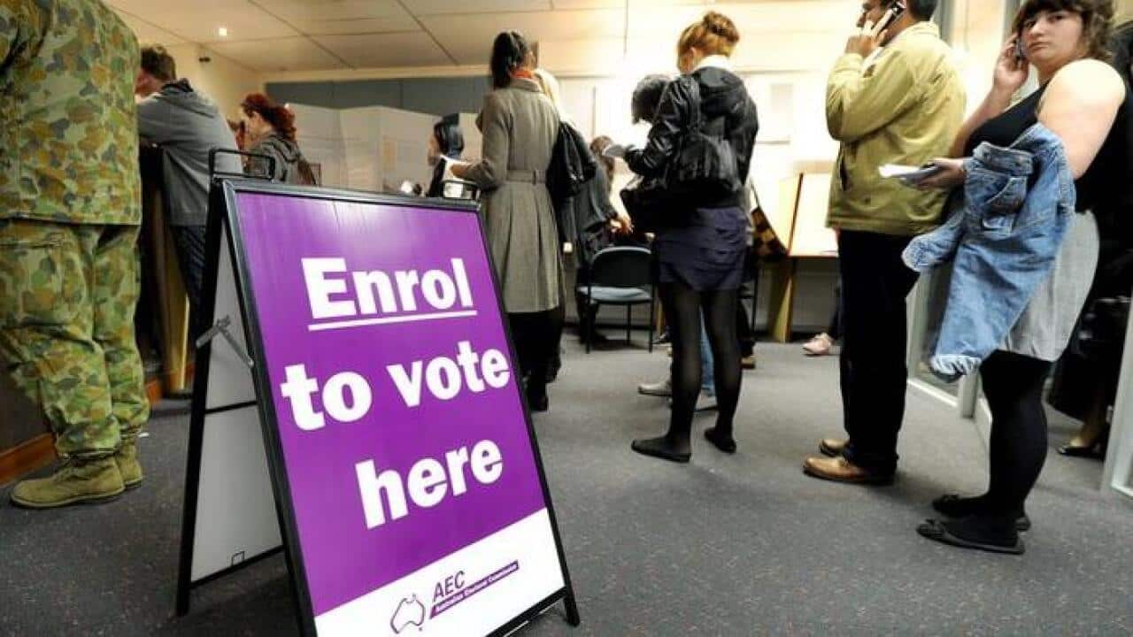 People queue up with enrol to vote