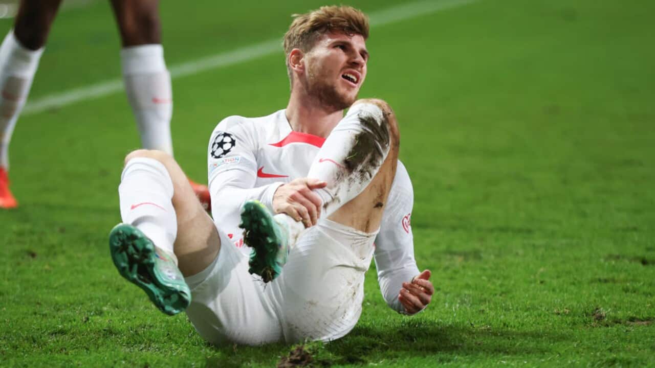 Timo Werner reacts after sustaining an injury during RB Leipzig's UEFA Champions League match