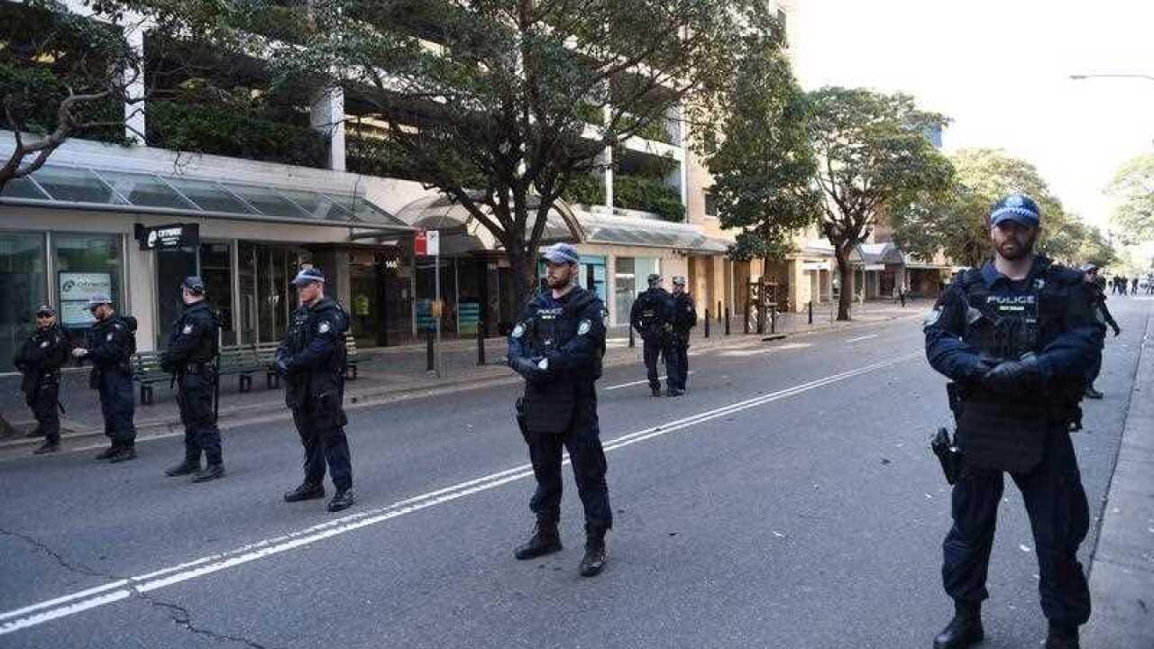 NSW Police riot squad take up position outside the Parramatta mosque in Sydney.