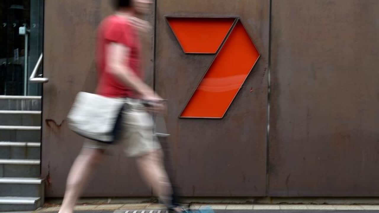 A file image of a person walking past the Sydney Seven Network office.