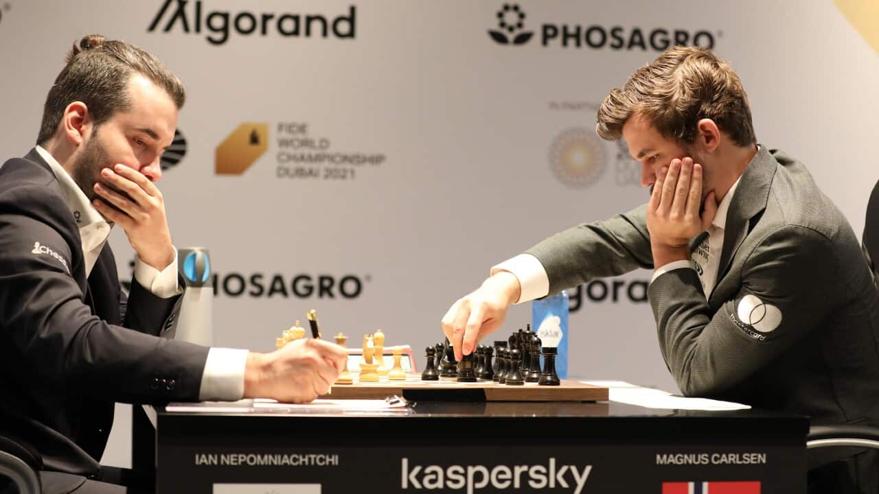 Defending Champion Magnus Carlsen (R) of Norway plays against Ian Nepomniachtchi of Russia during the fifth round of FIDE World Chess Championship during the EXPO 2020 Dubai in Dubai, United Arab Emirates, 01 December 2021. Some 192 countries take part i