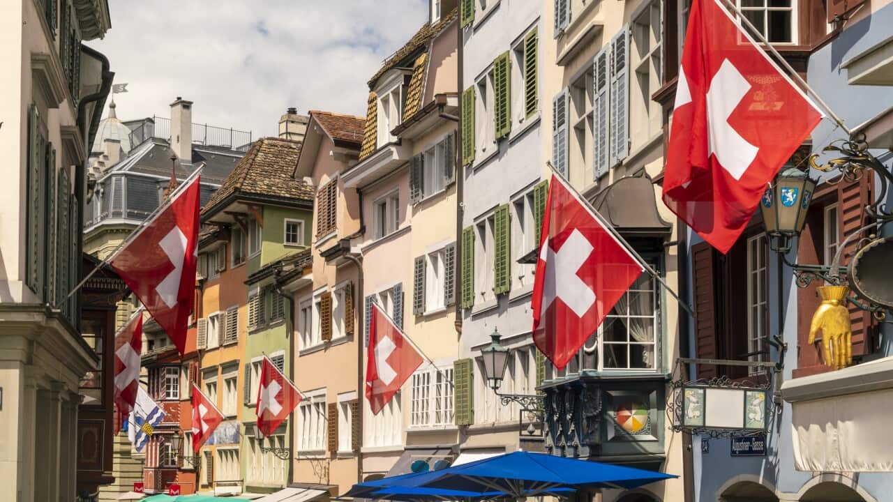 Swiss flags on houses along street