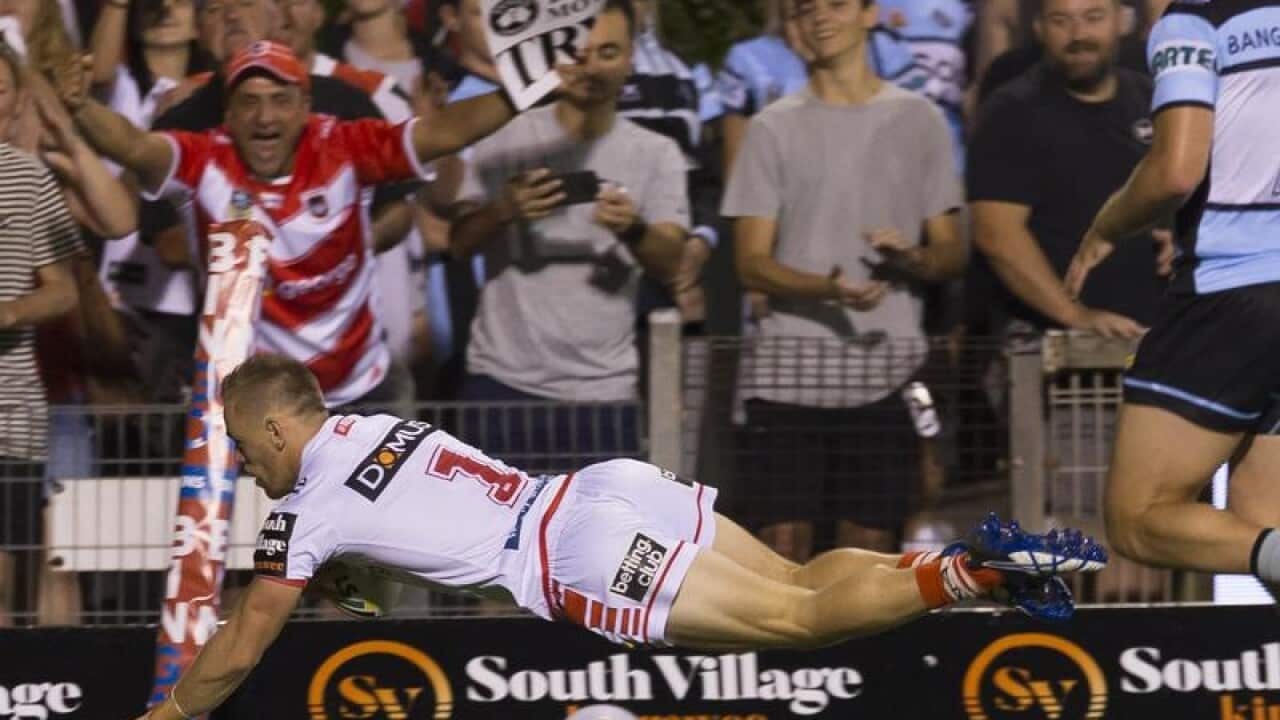 Matthew Dufty of the Dragons scores.