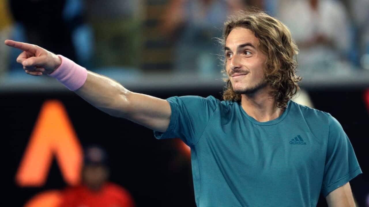 Greece's Stefanos Tsitsipas celebrates after defeating Georgia's Nikoloz Basilashvili during their third round match at the Australian Open tennis championships in Melbourne, Australia, Friday, Jan. 18, 2019. (AP Photo/Mark Schiefelbein)