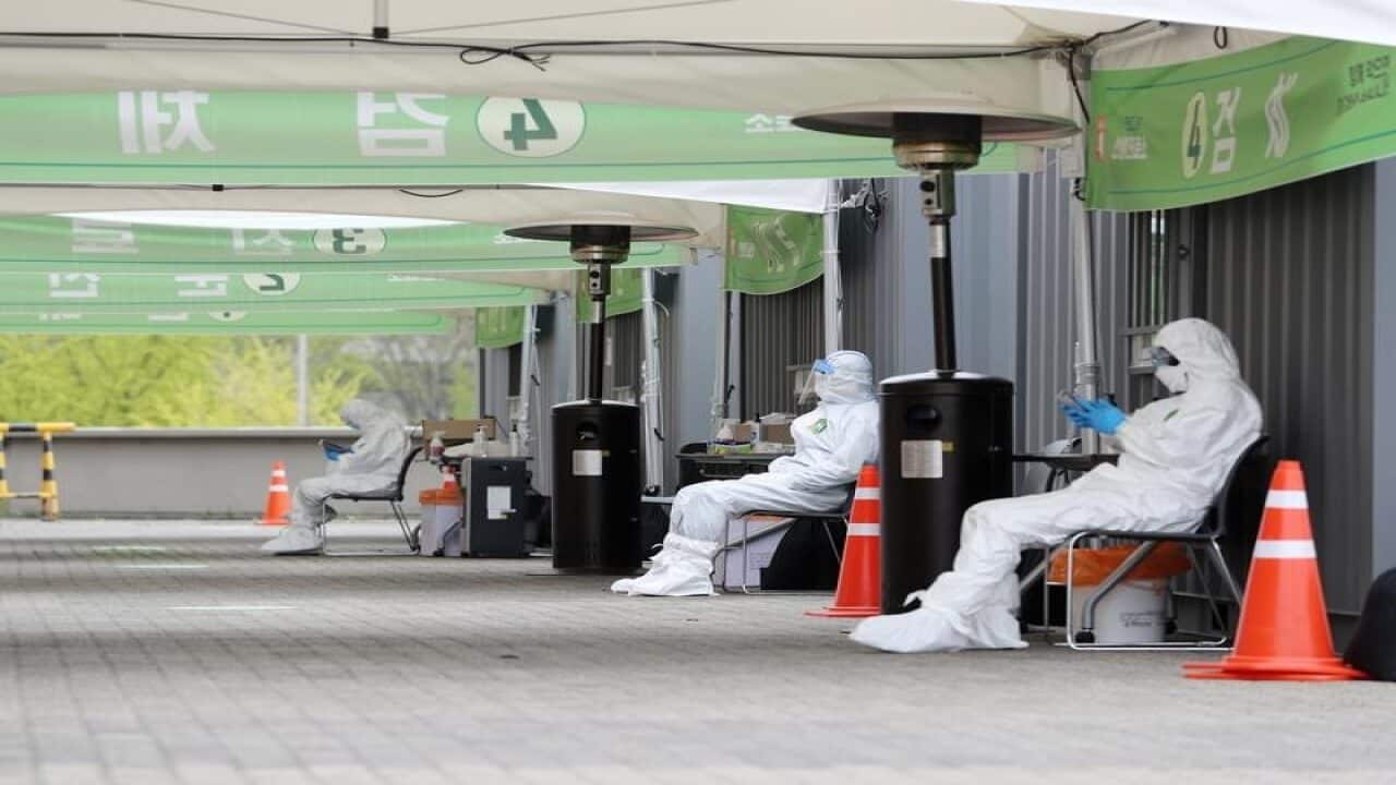 Staff at a drive-through testing centre