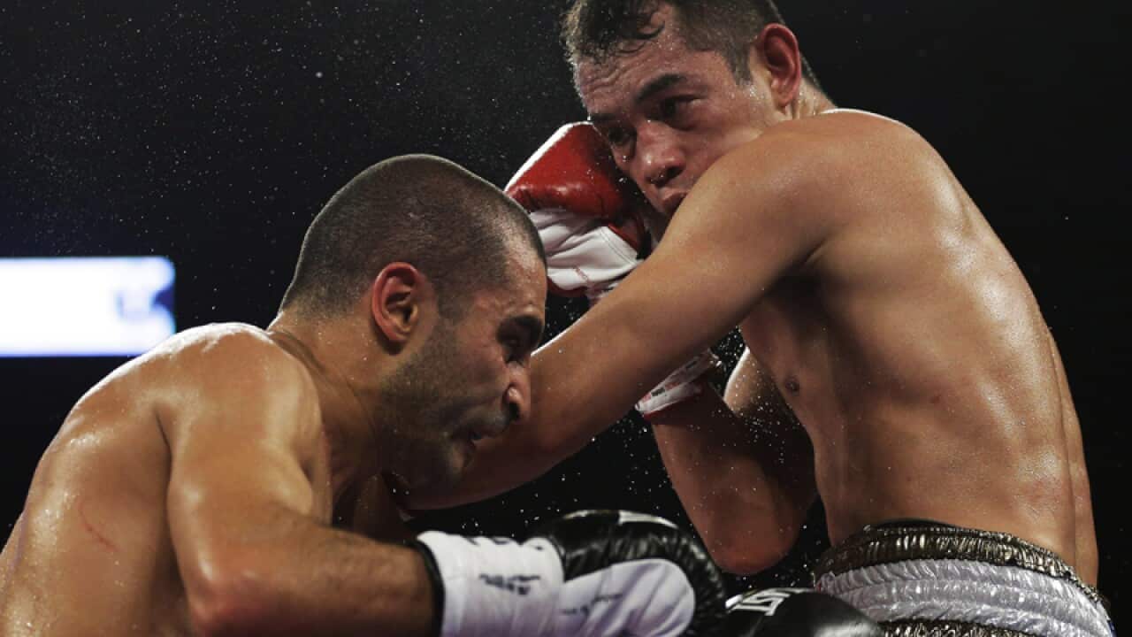 Nonito Donaire, right, lands a punch on Vic Darchinyan.