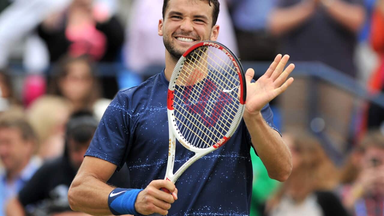 Bulgaria’s Grigor Dimitrov celebrates after winning