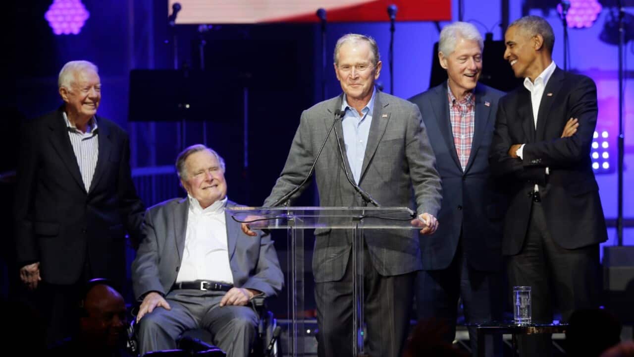 Former Presidents from right, Barack Obama, Bill Clinton, George W. Bush, George H.W. Bush and Jimmy Carter gather on stage during a hurricanes relief concert