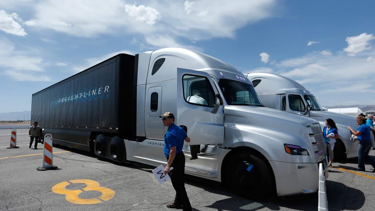 People load in to a Daimler Freightliner Inspiration self-driving truck for a demonstration Wednesday, May 6, 2015, in Las Vegas. (AP Photo/John Locher)