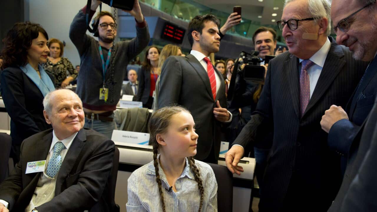 Swedish climate activist Greta Thunberg is greeted by European Commission President Jean-Claude Juncker.