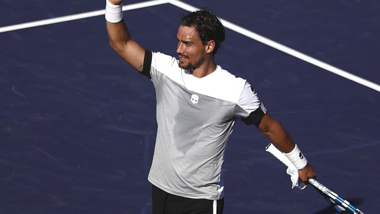 Fabio Fognini of Italy waves after winning his match