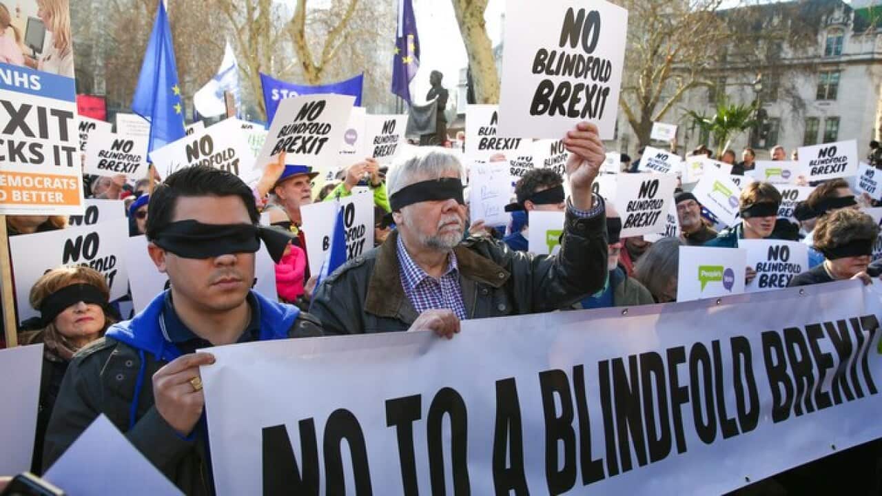 Blindfolded demonstrators in London's Parliament Square say the Brexit deal provides no clarity