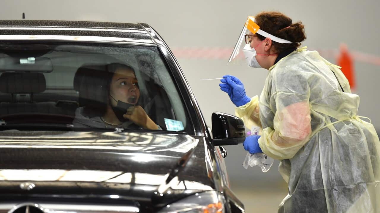 Members of the public are tested at a COVID-19 testing centre in Melbourne, Friday, March 18, 2022.