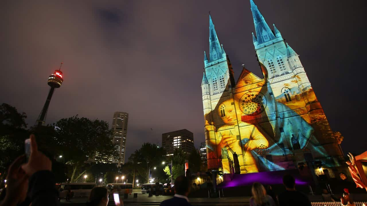 St Mary's Cathedral is illuminated with projections as part of Lights of Christmas in Sydney, Monday, December 9, 2019. (AAP Image/Steven Saphore) NO ARCHIVING