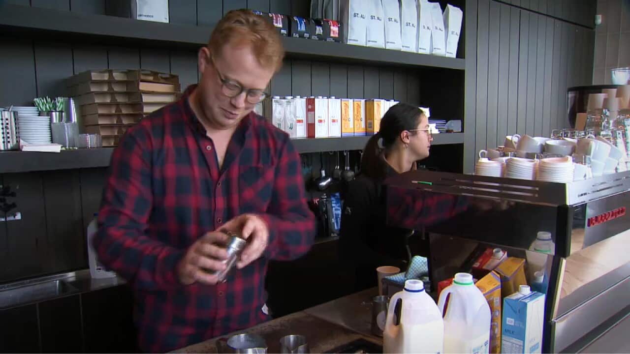 Daniel Dick working in his Melbourne cafe (SBS).jpg