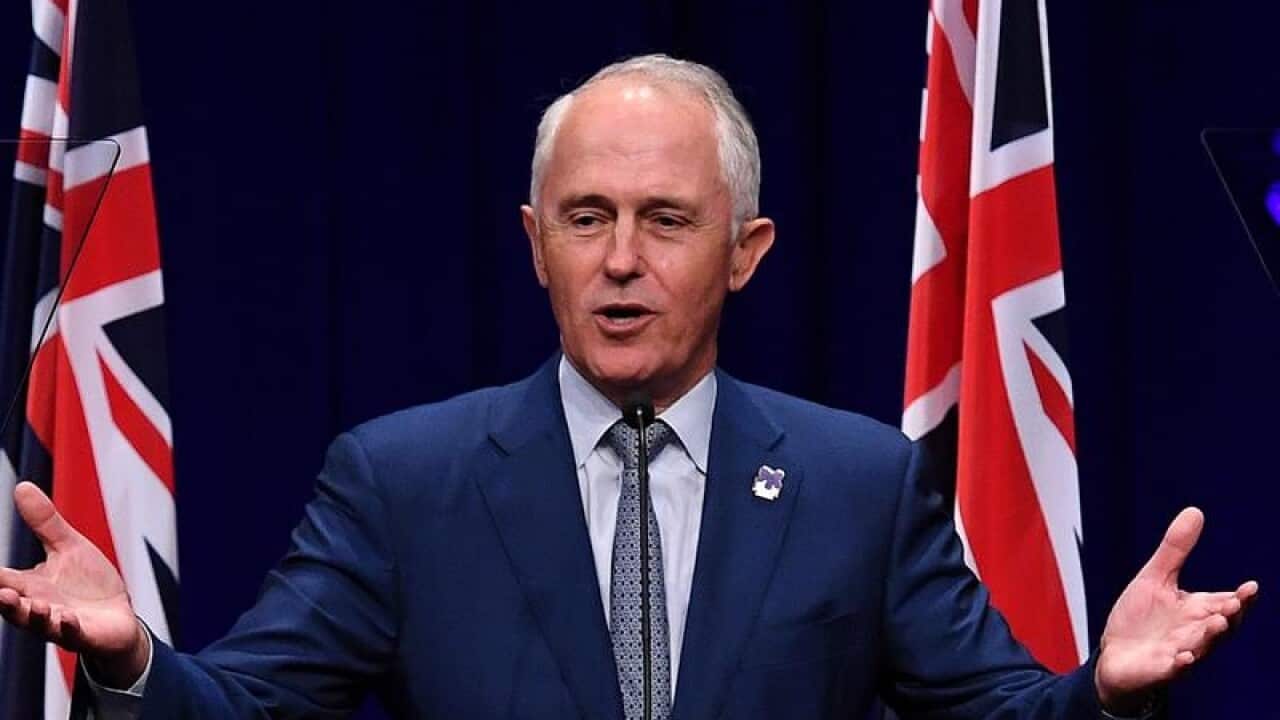 Malcolm Turnbull speaks from behind a lectern in Toowoomba.