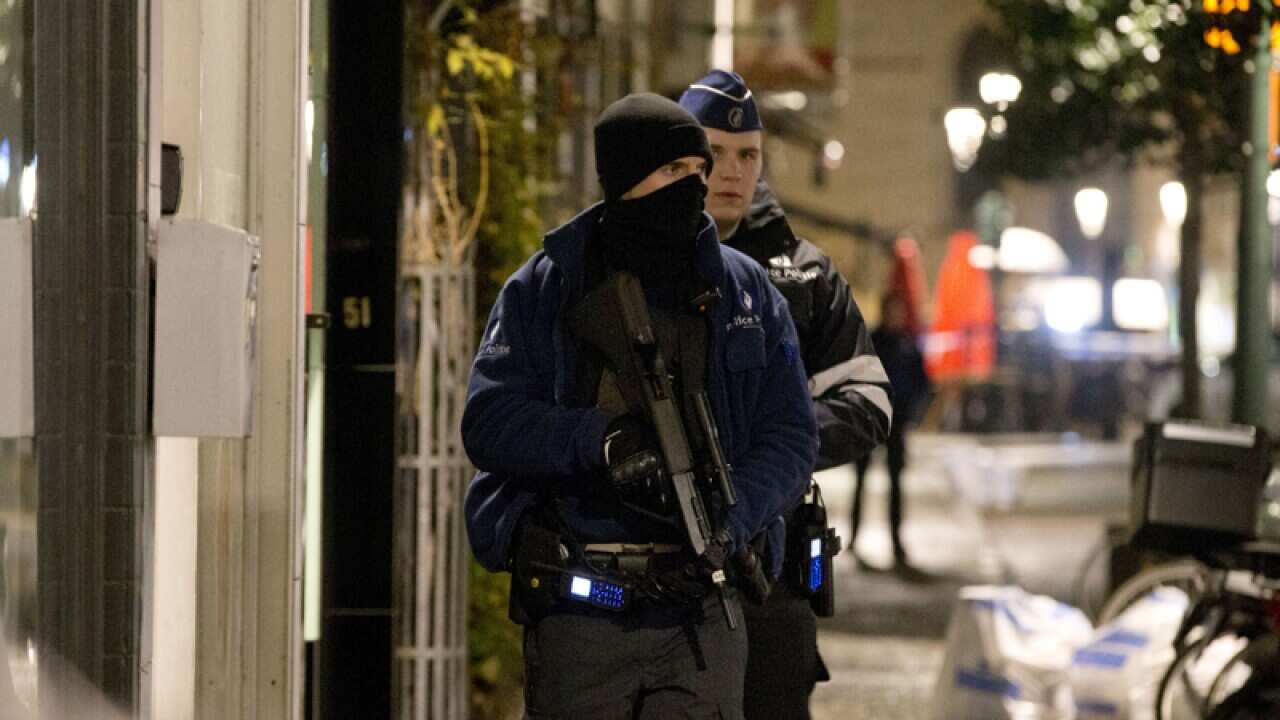 Police patrol during an operation in the center of Brussels.
