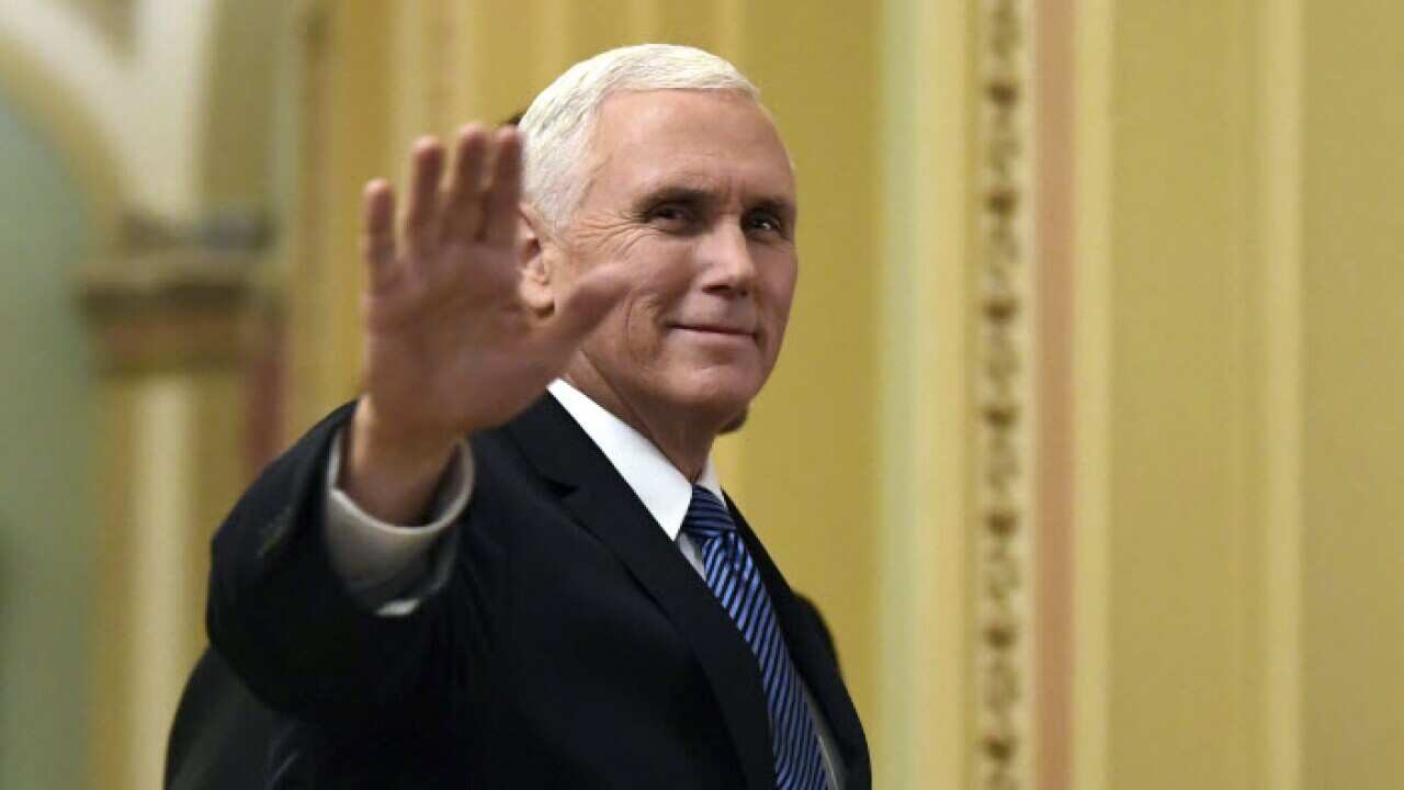 Vice President Mike Pence waves as he walks on Capitol Hill in Washington. Pence will visit Egypt, Jordan and Israel later this month after postponing a trip to the Middle East in December following President Donald Trump's decision to recognize Jerusalem