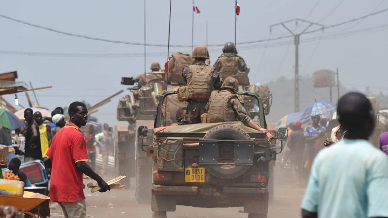 French soldiers drive their vehicles and armoured cars