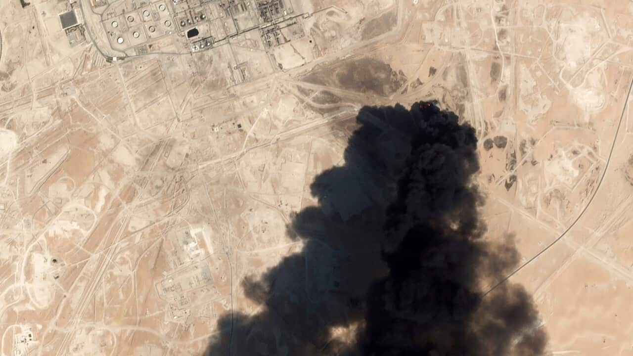 A satellite image shows thick black smoke rising from Saudi Aramco's Abqaiq oil processing facility