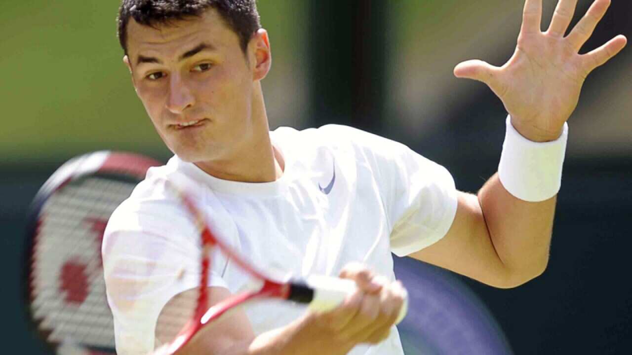 Tomic wins, Hewitt loses in Washington