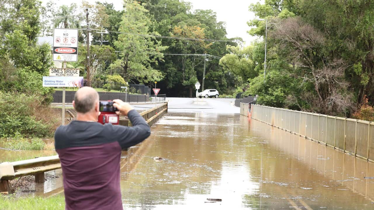 A photographer captures flooding on a Lismore bridge