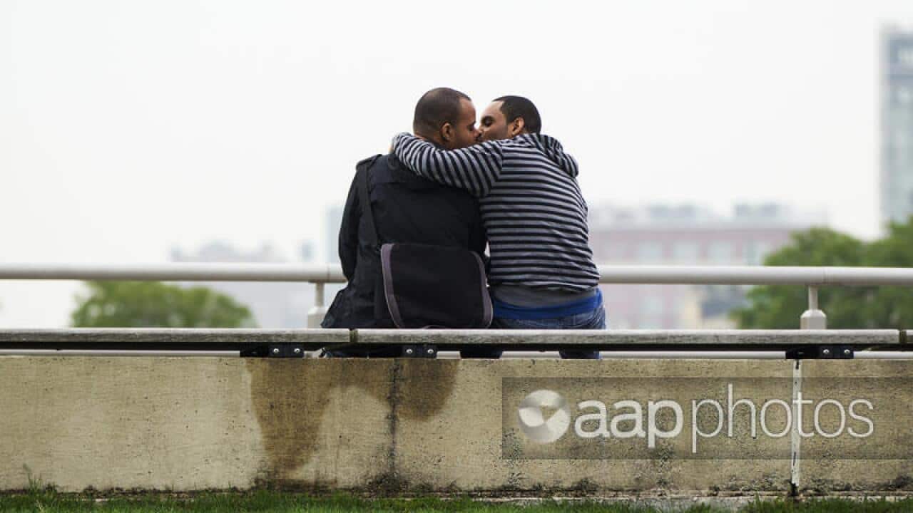 Two men kissing Reuters.jpg