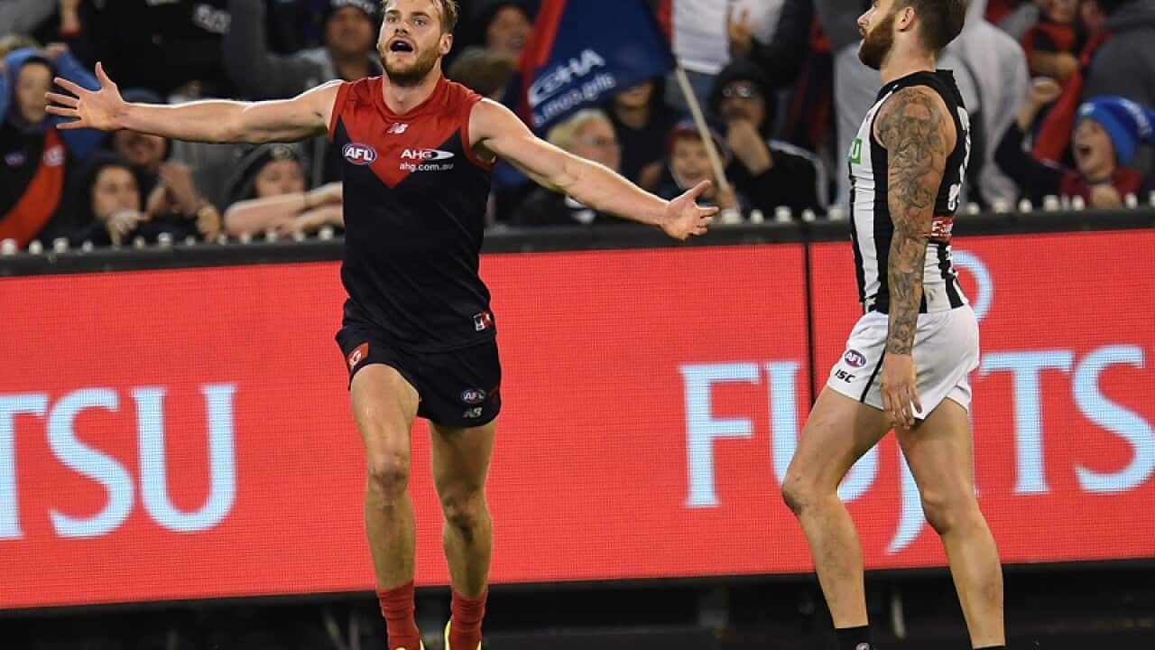 Jack Watts (L) of the Demons