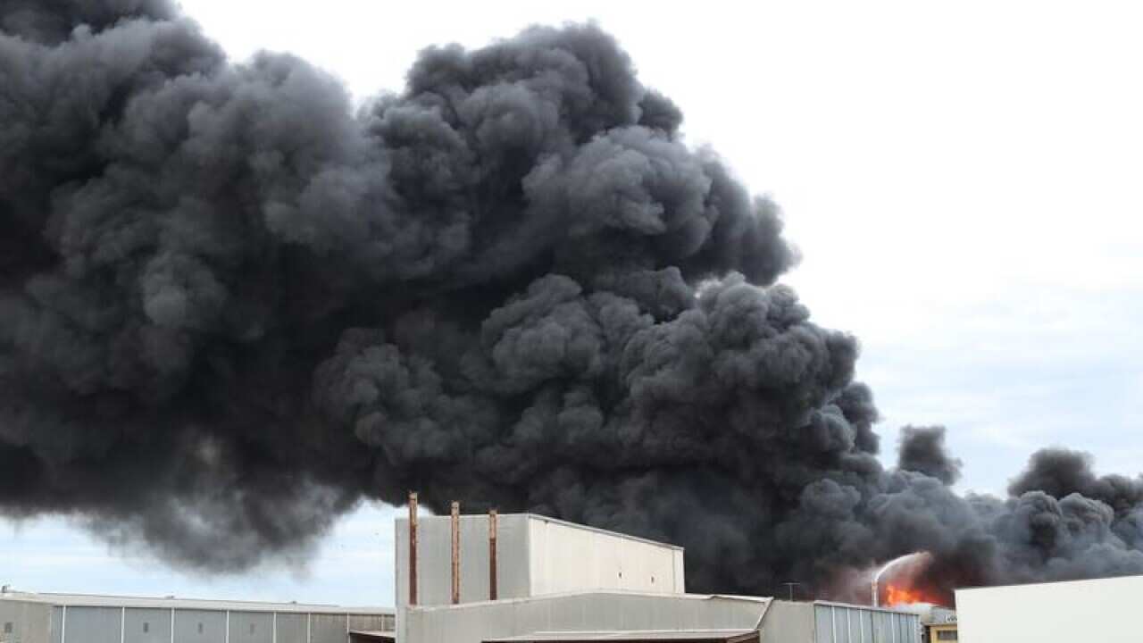 Fire crews battle to control a blaze at a factory in West Footscray