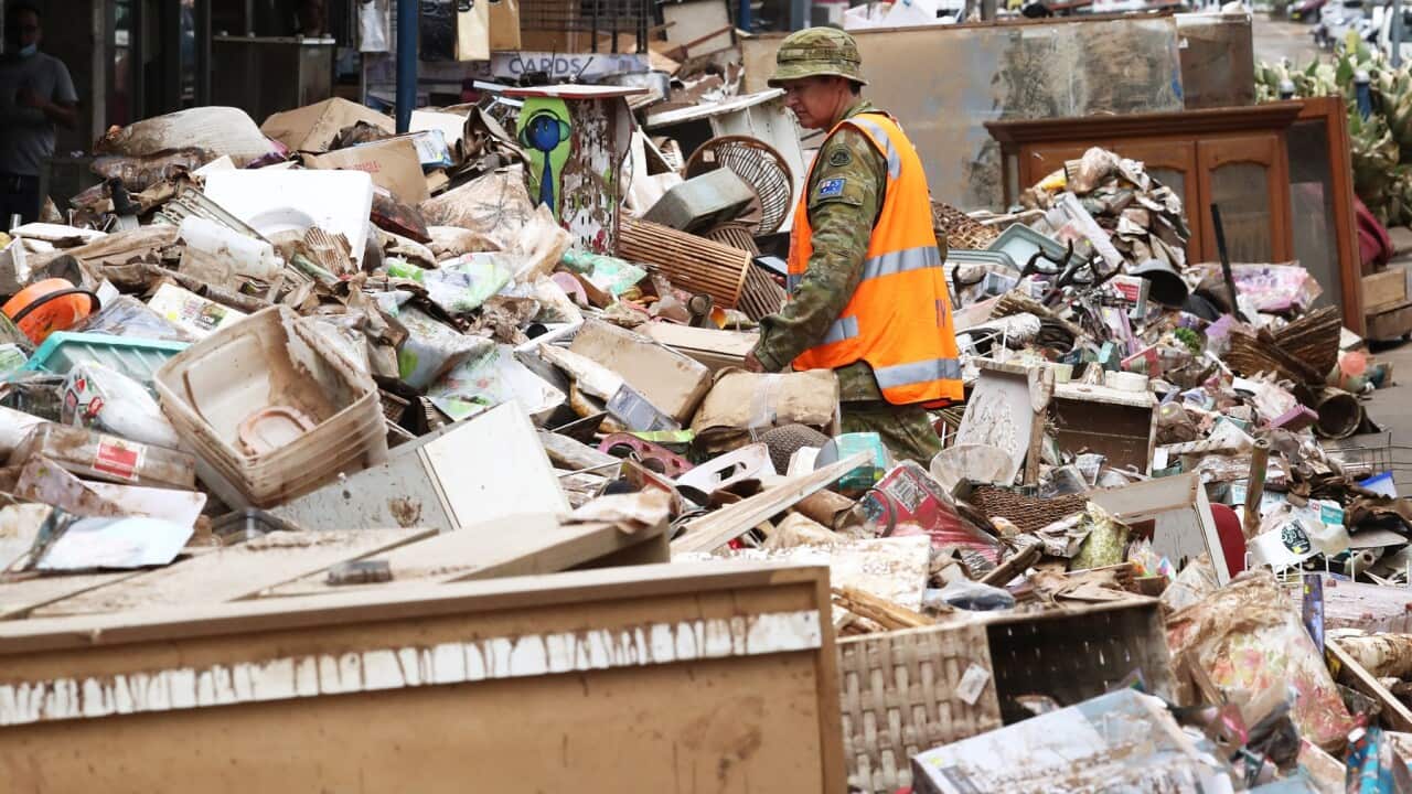 Australian Defence Force Personel assist with the clean up after the floods in the Central Business District of Lismore, NSW, Friday, March 4, 2022. (AAP Image/Jason O'Brien) NO ARCHIVING