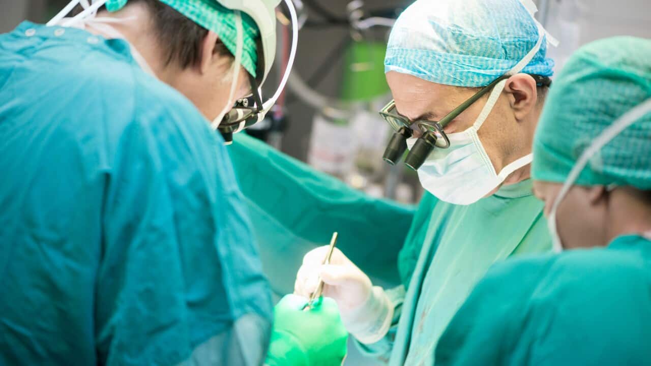 Heart surgeons during a heart operation
