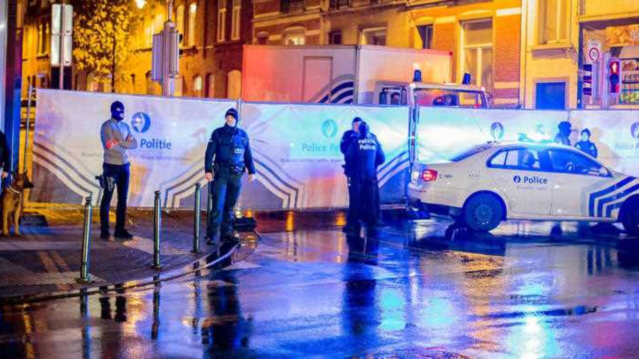 Police guard a street in Brussels where arrests were made linked to the attacks in Paris.