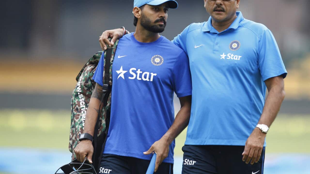 Ravi Shastri (R) interacts with cricketer Murali Vijay