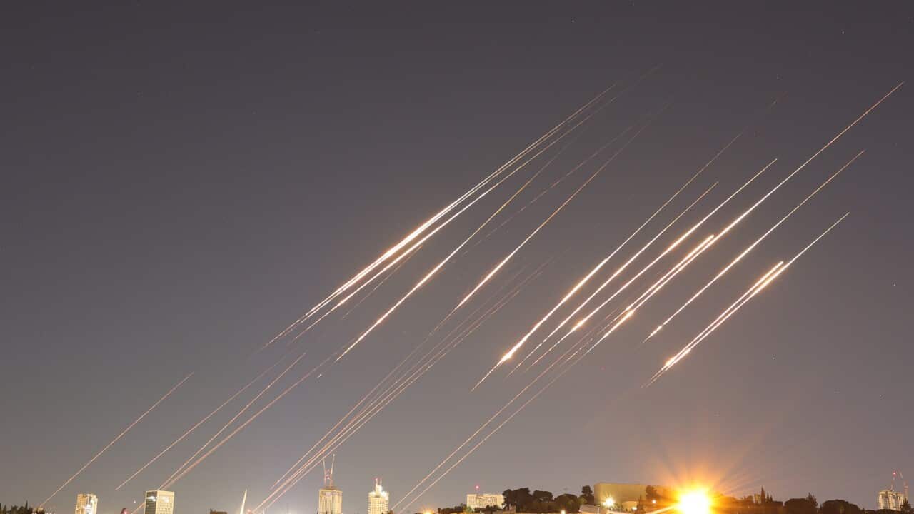 A slow exposure picture shows ballistic missiles above Jerusalem
