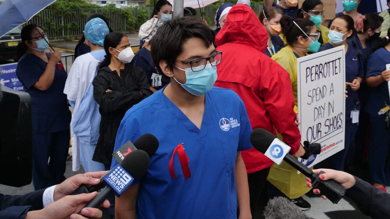 Westmead Hospital nurse Timothy Blofield speaks to reporters outside Westmead Hospital in Sydney, Wednesday, January 19, 2022. (AAP Image/Sam McKeith) NO ARCHIVING