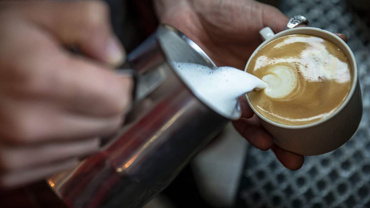 A man seen adding milk into the coffee during the World Coffee Day.On World Coffee Day, Fahriye Cafe, located in Moda district of Kadikoy, offers many types of coffee and desserts.