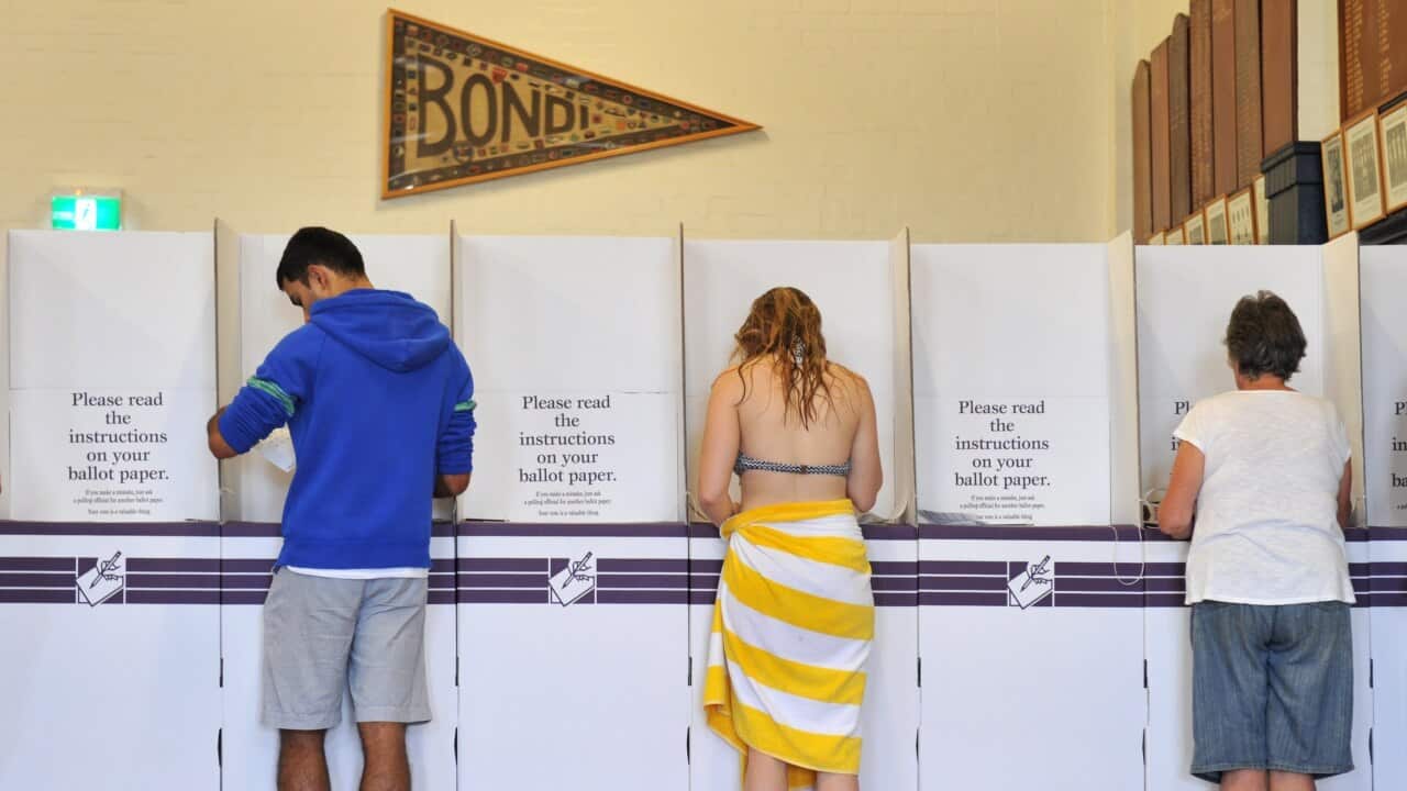 Residents cast their vote at Bondi Surf Bathers Life Saving Club on the morning of the Federal Election in Sydney. (AAP)