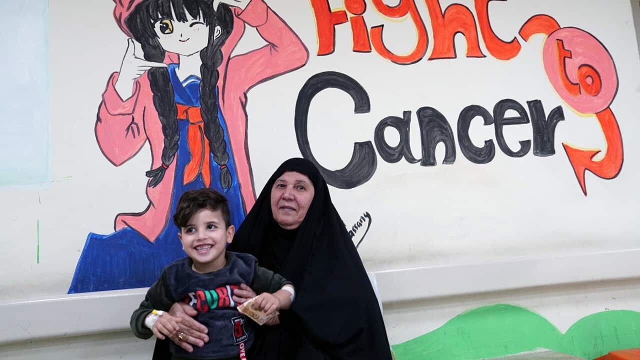 A woman with a child suffering from leukemia